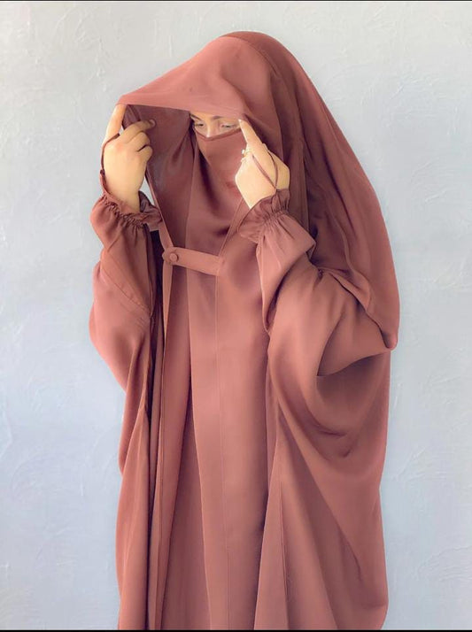 girl wearing pink abaya